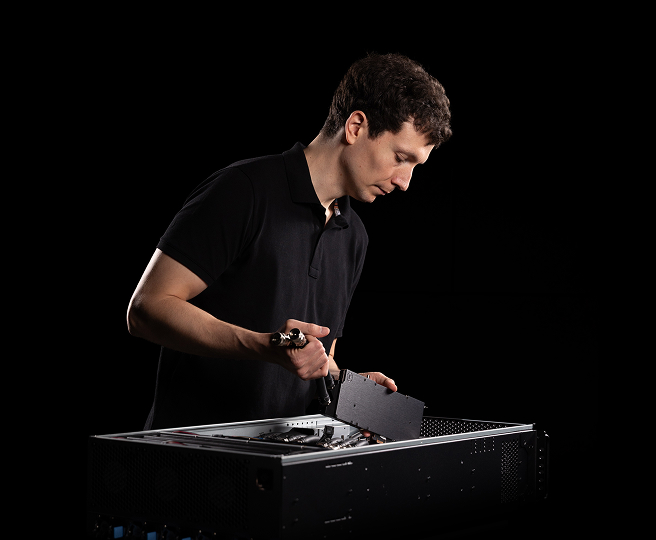 An engineer servicing the server's liquid cooling loop