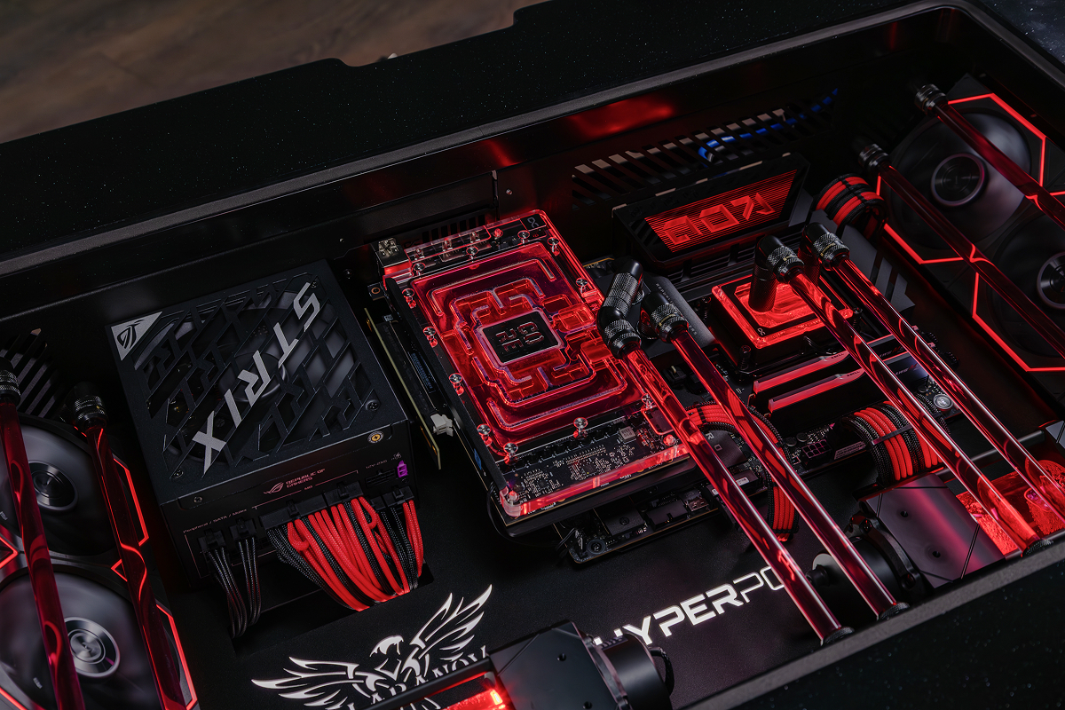 Interior of HYPERPC DESK with an RTX 5090 and a red liquid-cooling loop
