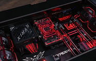 Interior of HYPERPC DESK with an RTX 5090 and a red liquid-cooling loop