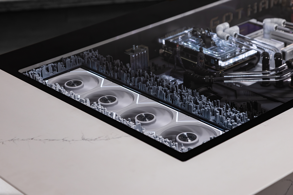 Gotham diorama beneath the glass desktop of the HYPERPC DESK
