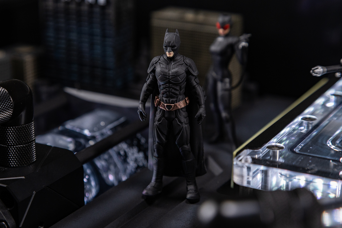 Batman universe character figures inside the computer desk