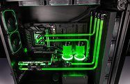 Interior of the upgraded system: custom tubing and reservoirs with green coolant