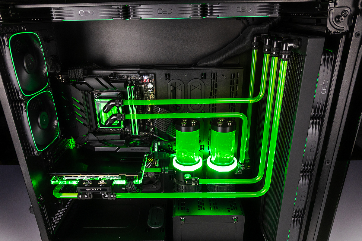 Interior of the upgraded system: custom tubing and reservoirs with green coolant