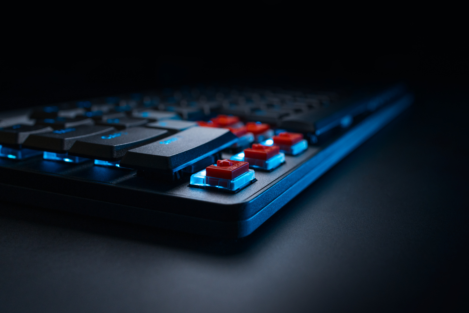 Magnetic low-profile keyboard with RGB lighting on a gaming desk