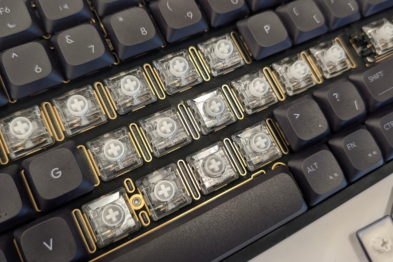Close-up of low-profile linear switches under flat keycaps