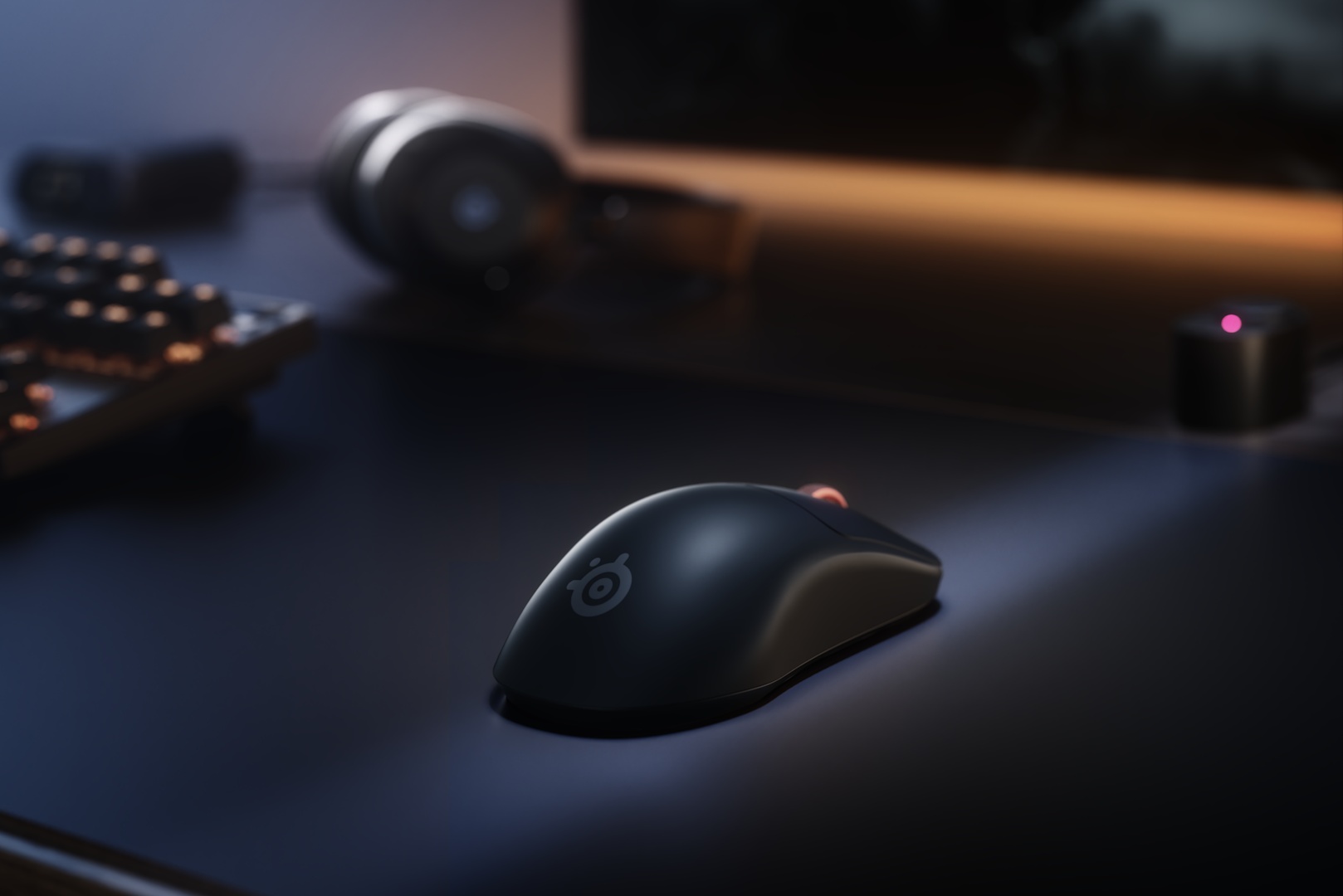 SteelSeries Sensei Pro gaming mouse next to the charging base that works as a UWB receiver